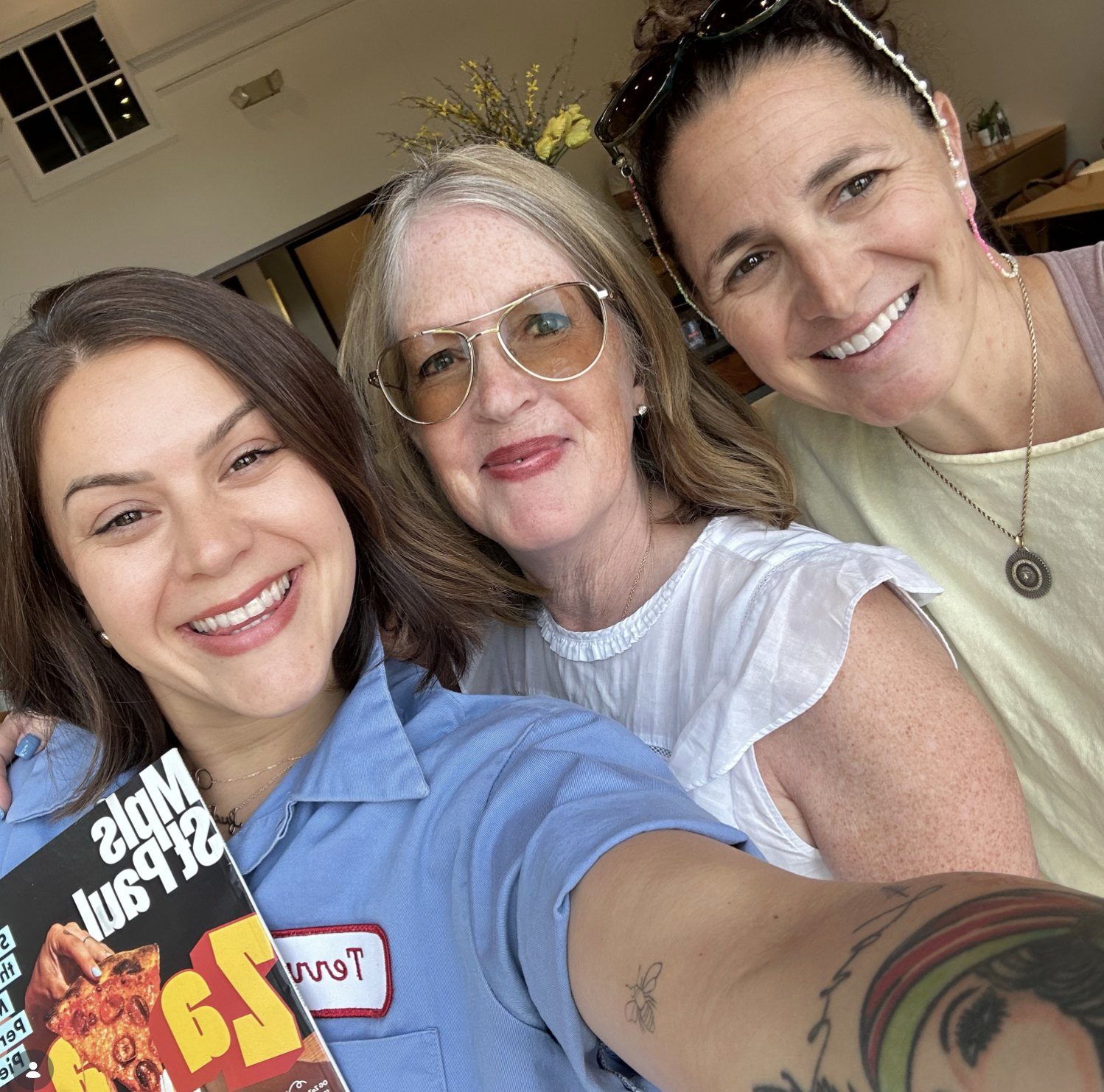 Three colleagues with Mpls St Paul magazine