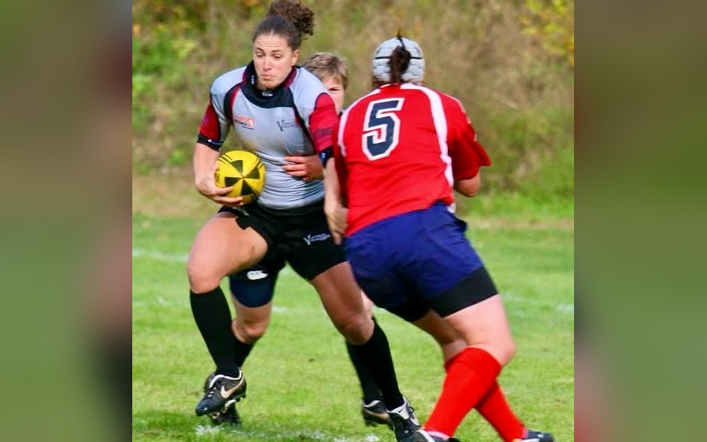 Tracy Call carrying the ball in a rugby match