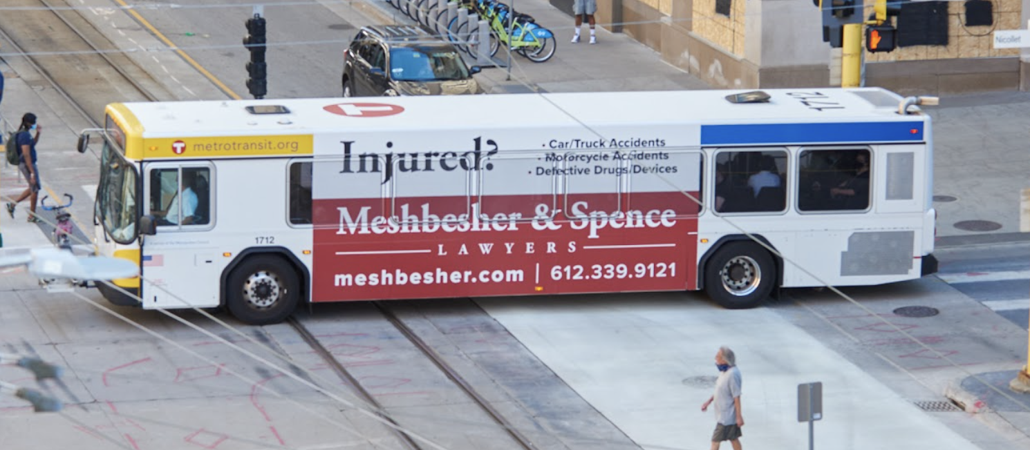 Meshbesher & Spence transit wrap on a Metro Transit bus