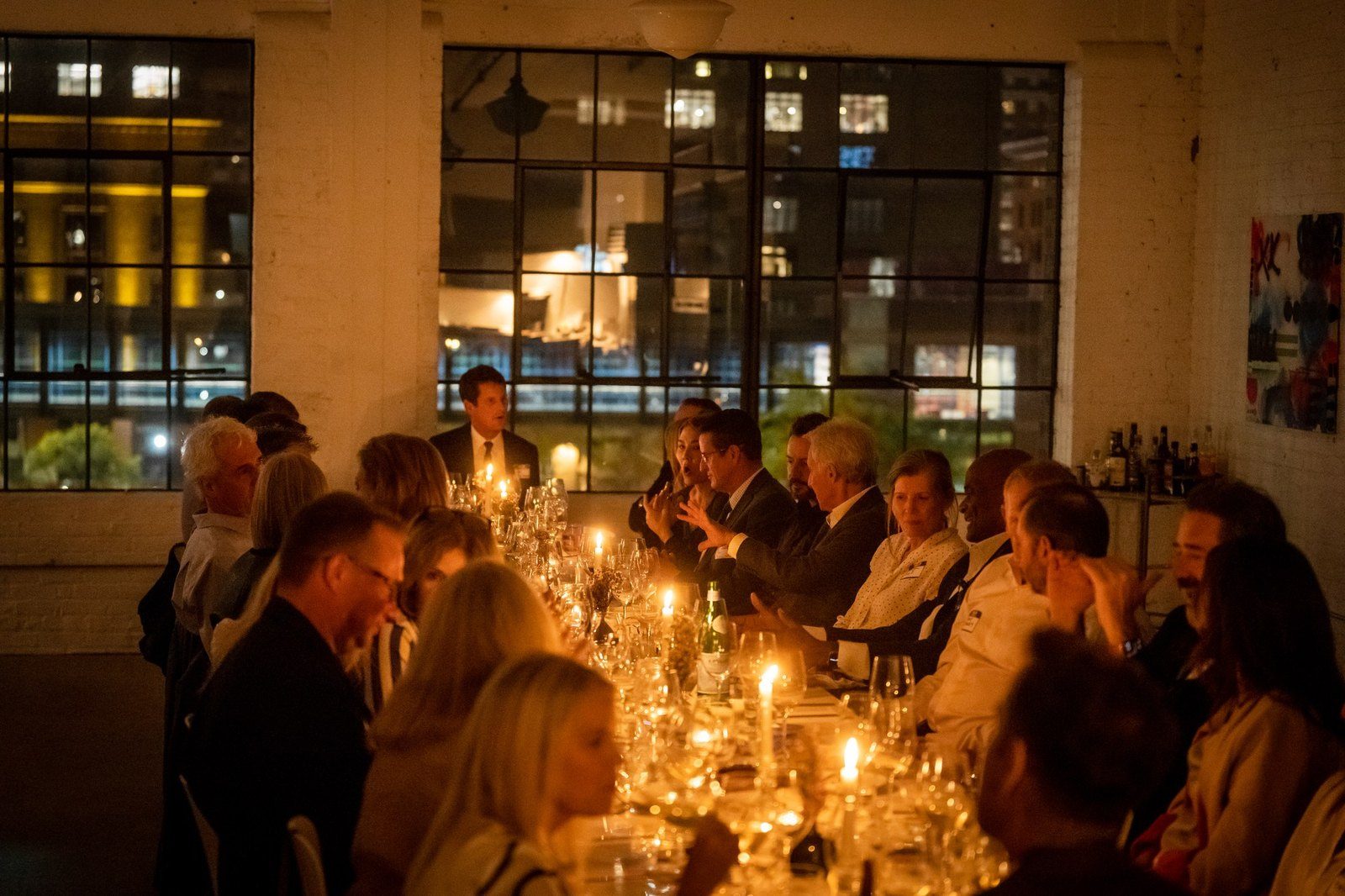 A U.S. Bank Dining Club dinner, candlelit long table